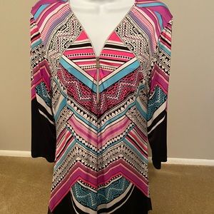 Fun top V-neck with zipper great with Leggins